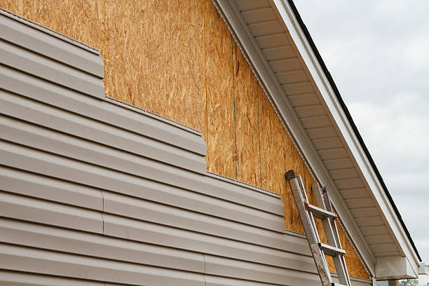 Professional Siding Replacement technician working in Lehigh Acres, FL